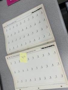 mad minute worksheets sitting by the copy machine.